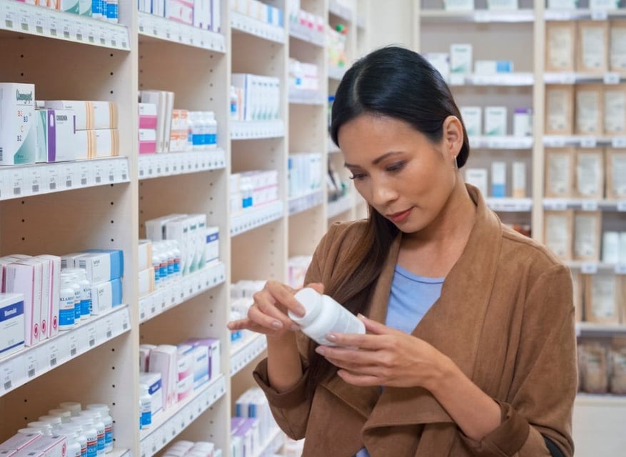 Scientist reviewing labeled medicine bottle on a pharmacy shelf during regulatory compliance check.